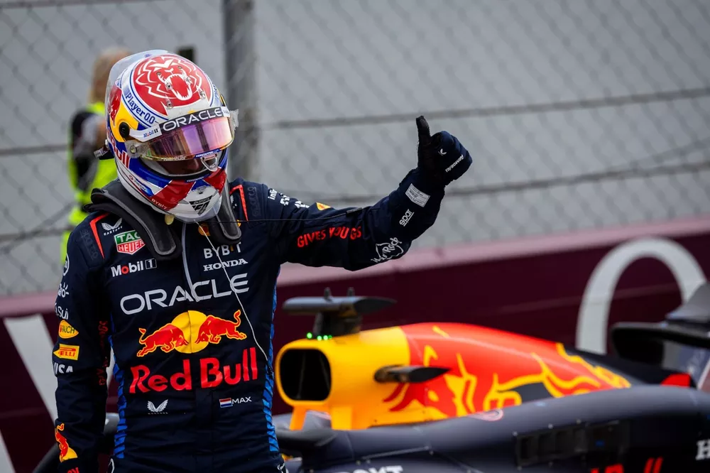 Max Verstappen, Red Bull Racing, gives someone a thumbs up in Parc Ferme