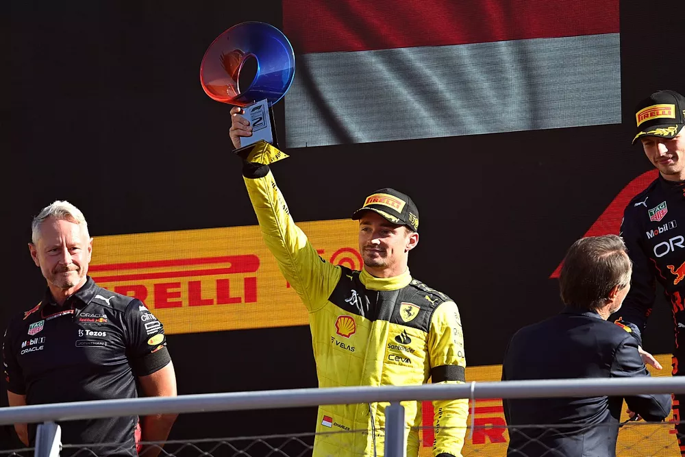 Charles Leclerc, Ferrari, 2nd position, lifts his trophy