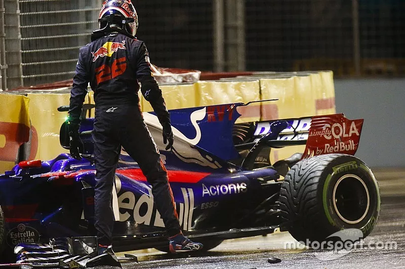 Daniil Kvyat, Scuderia Toro Rosso, climbs out of his car after crashing out