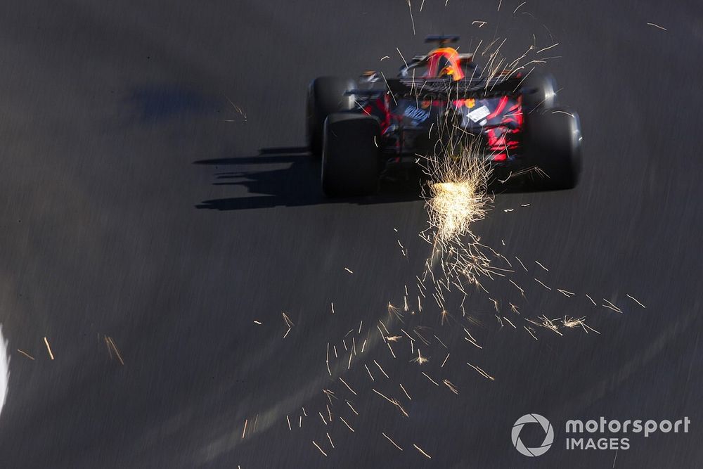 Sparks fly from the rear of Max Verstappen, Red Bull Racing RB16