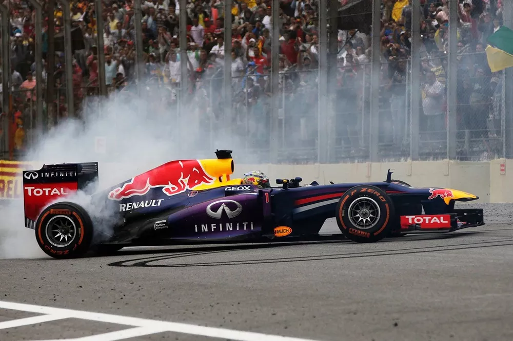 Sebastian Vettel, Red Bull RB9 Renault celebrates victory with donuts