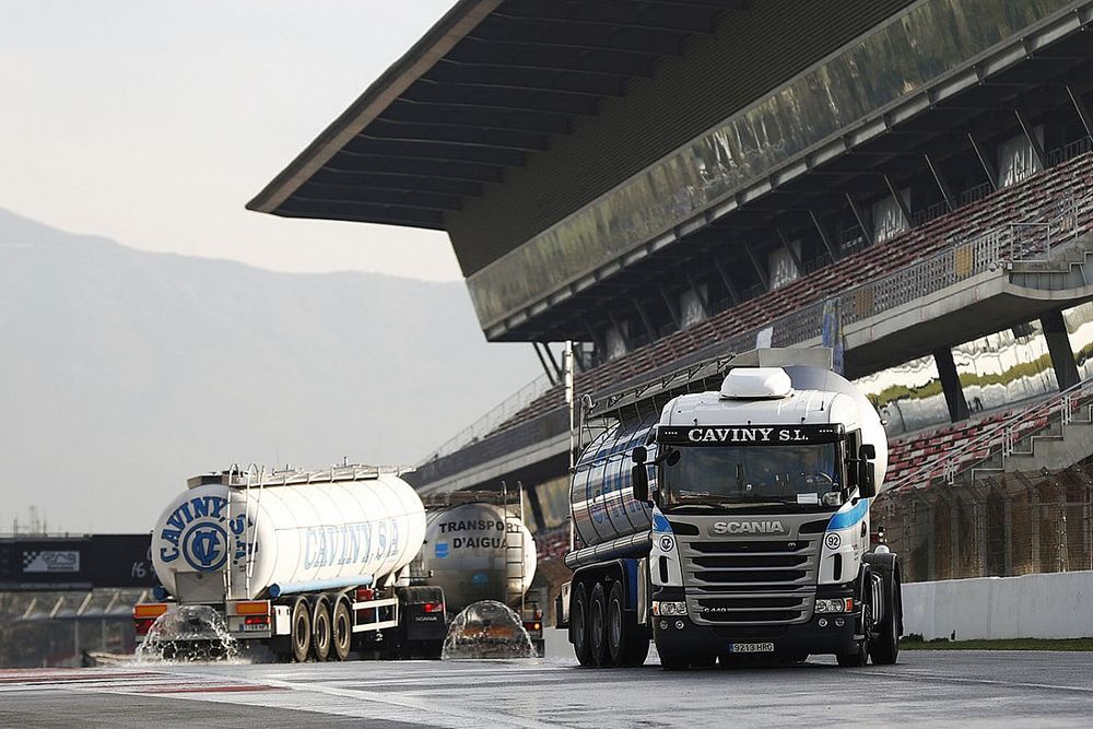 Trucks water the circuit for wet tyre testing