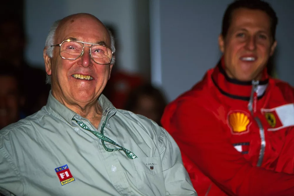 L-R: Murray Walker (GBR) bows out of commentating whilst Michael Schumacher(GER) looks on.