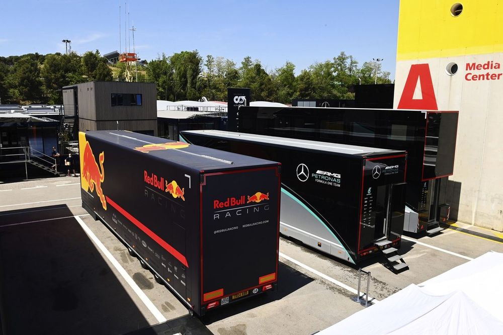 Red Bull and Mercedes truck in the paddock