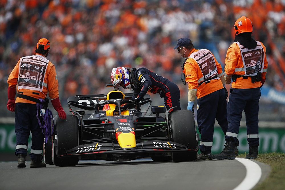 Max Verstappen, Red Bull Racing, climbs out of his car after stopping on circuit during FP1