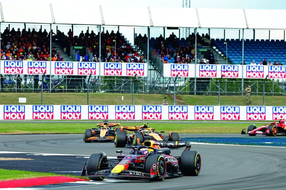 Max Verstappen, Red Bull Racing RB20, leads Lando Norris, McLaren MCL38, and Oscar Piastri, McLaren MCL38