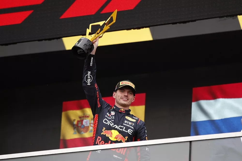Max Verstappen, Red Bull Racing, 1st position, lifts his trophy on the podium