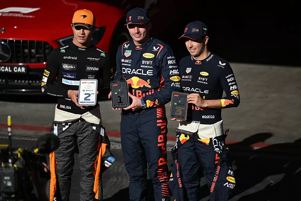 Lando Norris, McLaren, 2nd position, Max Verstappen, Red Bull Racing, 1st position, Sergio Perez, Red Bull Racing, 3rd position, on the Sprint racepodium with their trophies
