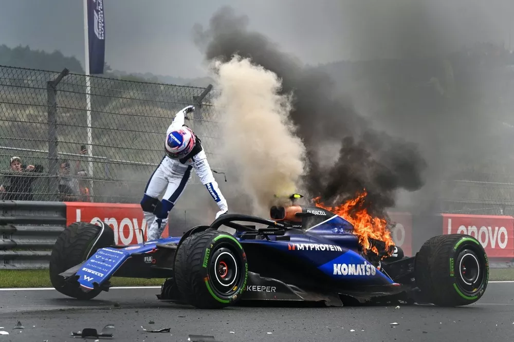 Logan Sargeant, Williams FW46, jumps out of his car after a crash in FP3