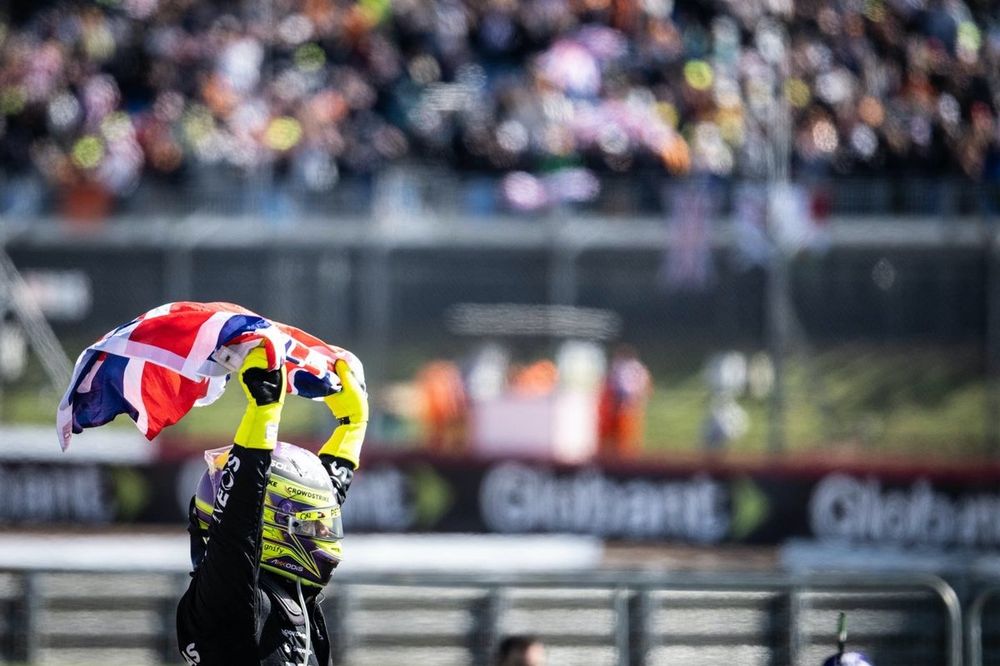 Lewis Hamilton, Mercedes-AMG F1 Team, 1st position, celebrates in Parc Ferme with a Union flag