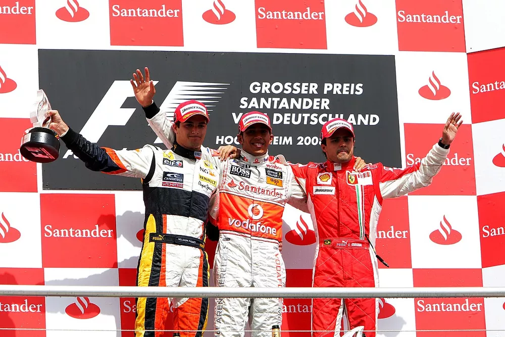 The podium: Nelson Piquet Jr., Renault second; Lewis Hamilton, McLaren, race winner; Felipe Massa, F