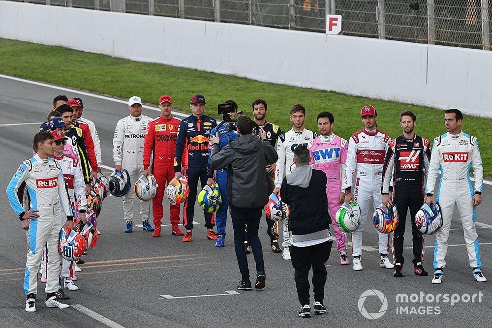 The drivers line up on the track