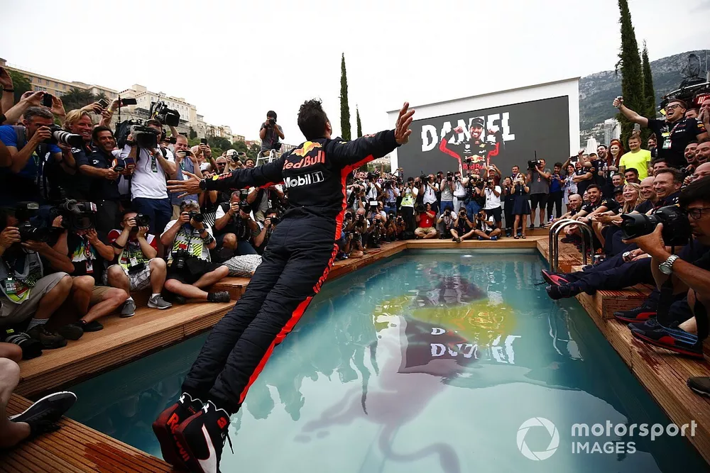 Daniel Ricciardo, Red Bull Racing, dives into the swimming pool on the Red Bull Energy Station
