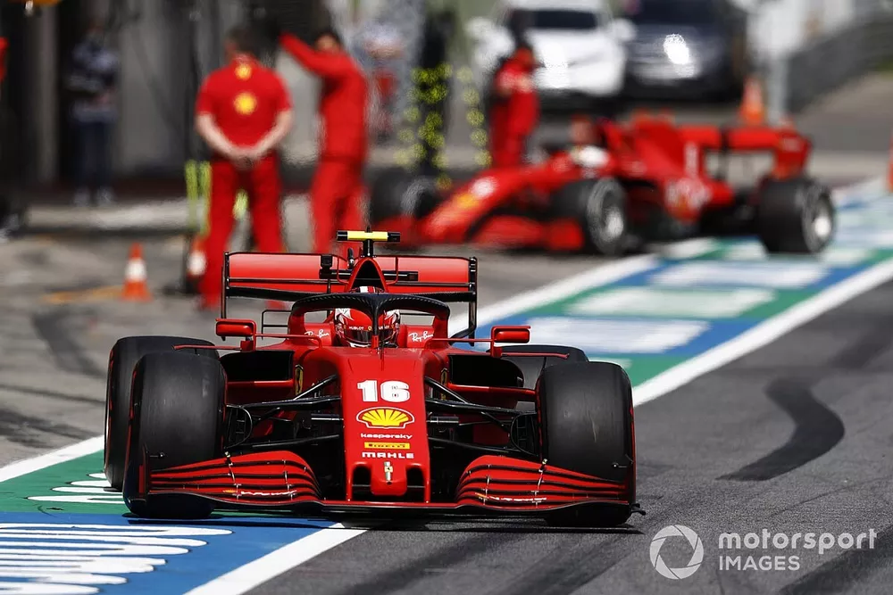 Charles Leclerc, Ferrari SF1000, leaves the pits as Sebastian Vettel, Ferrari SF1000 arrives.