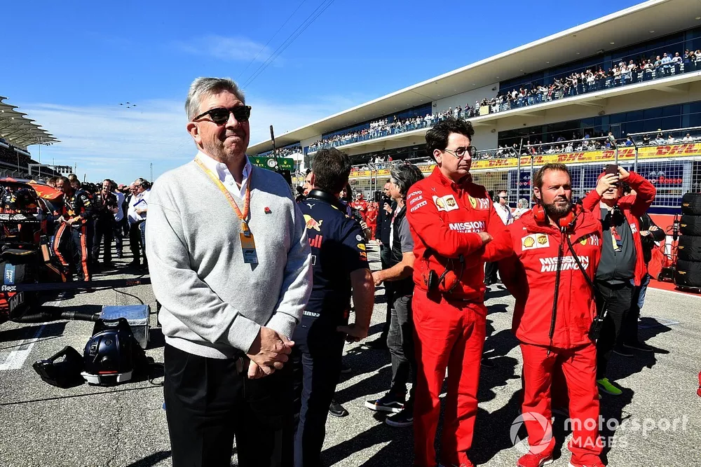 Ross Brawn, Managing Director of Motorsports, FOM, and Mattia Binotto, Team Principal Ferrari on the grid