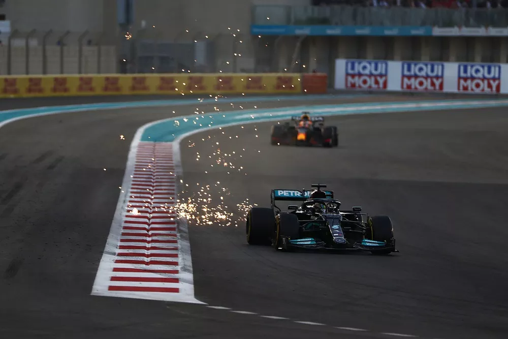 SParks fly as Lewis Hamilton, Mercedes W12, Max Verstappen, Red Bull Racing RB16B