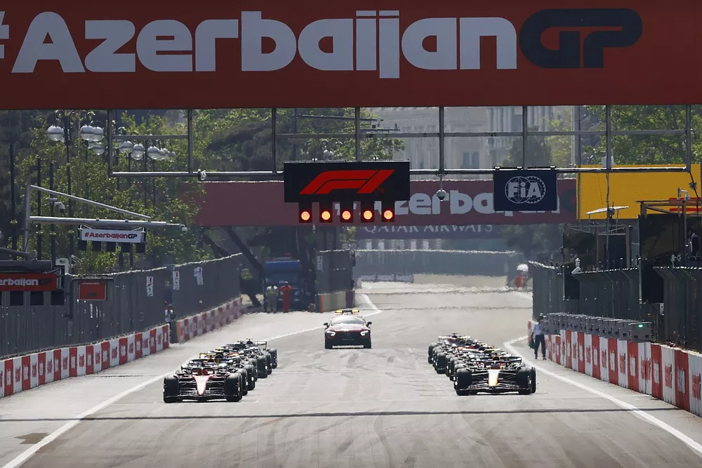 Charles Leclerc, Ferrari SF-23, Max Verstappen, Red Bull Racing RB19, prepare to lead the field away for the start