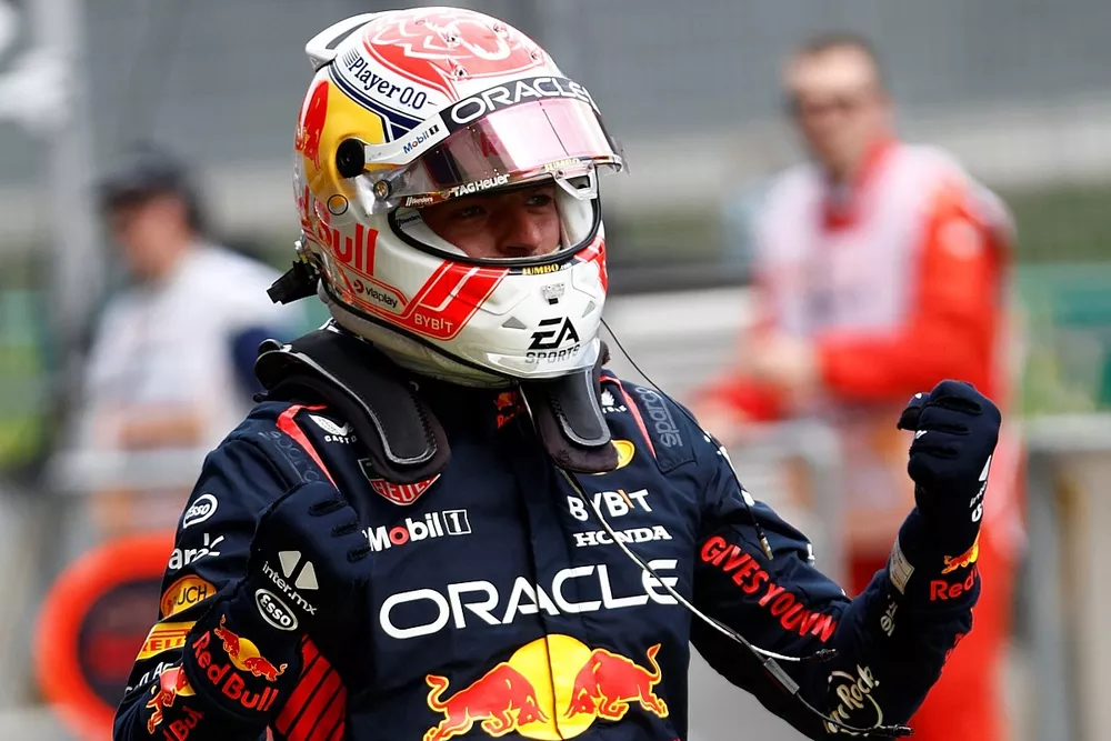 Max Verstappen, Red Bull Racing RB19, celebrates in Parc Ferme after securing pole 
