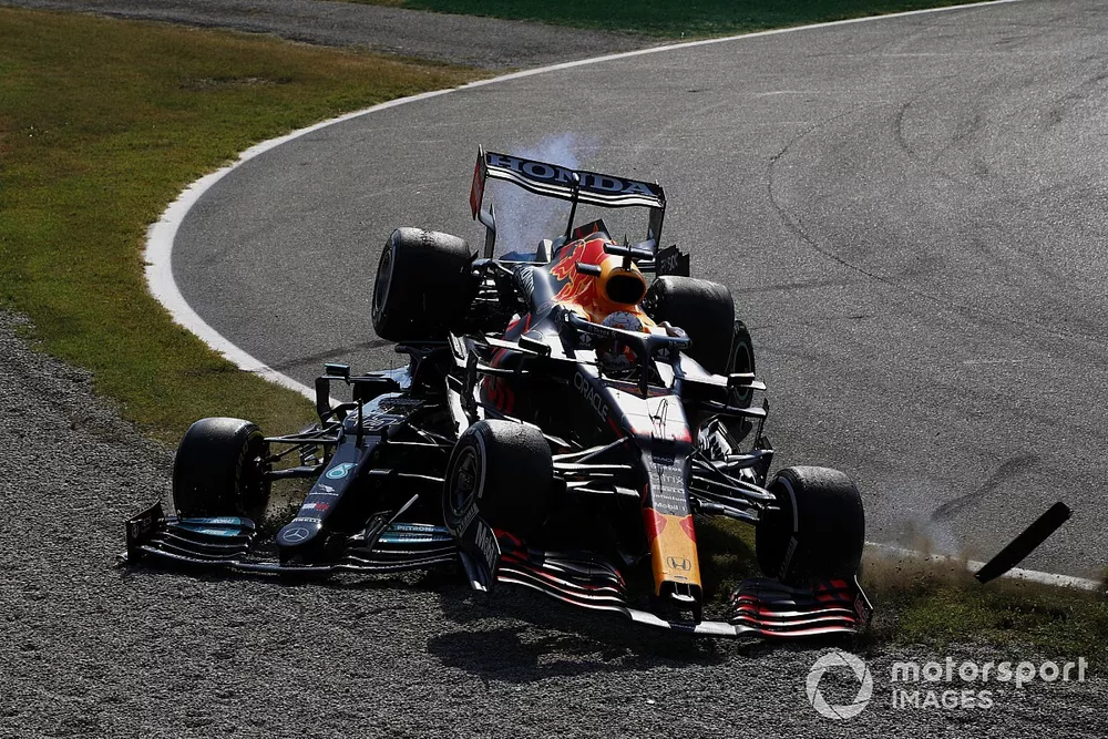 Lewis Hamilton, Mercedes W12, and Max Verstappen, Red Bull Racing RB16B, crash out of the race