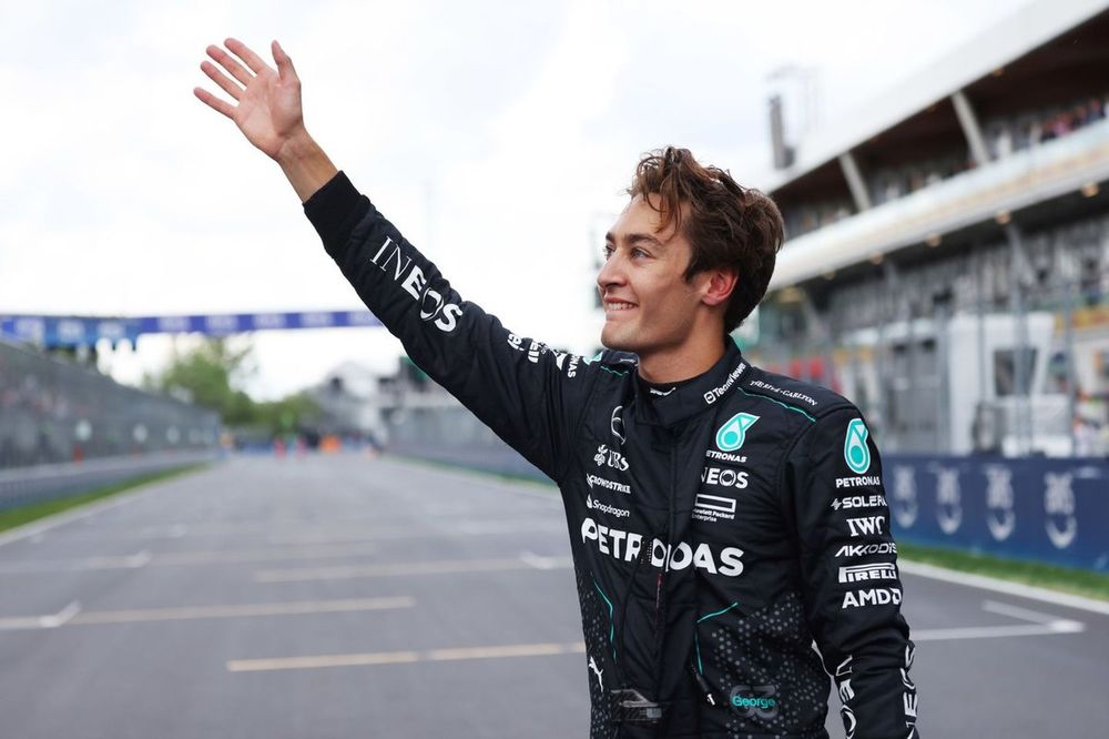 Pole man George Russell, Mercedes-AMG F1 Team, waves to fans after Qualifying