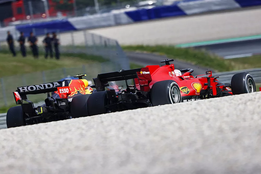 Sergio Perez, Red Bull Racing RB16B , battles with Charles Leclerc, Ferrari SF21

