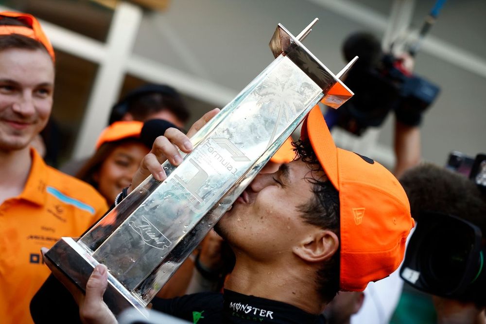 Lando Norris, McLaren F1 Team, 1st position, kisses the winners trophy