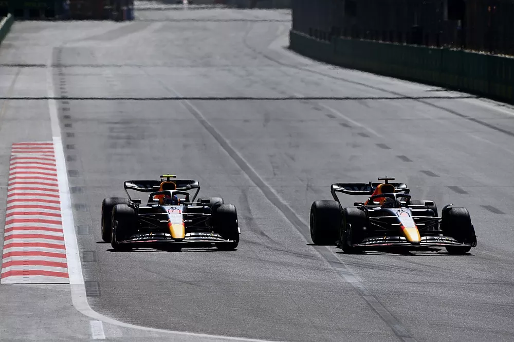 Max Verstappen, Red Bull Racing RB18, passes Sergio Perez, Red Bull Racing RB18