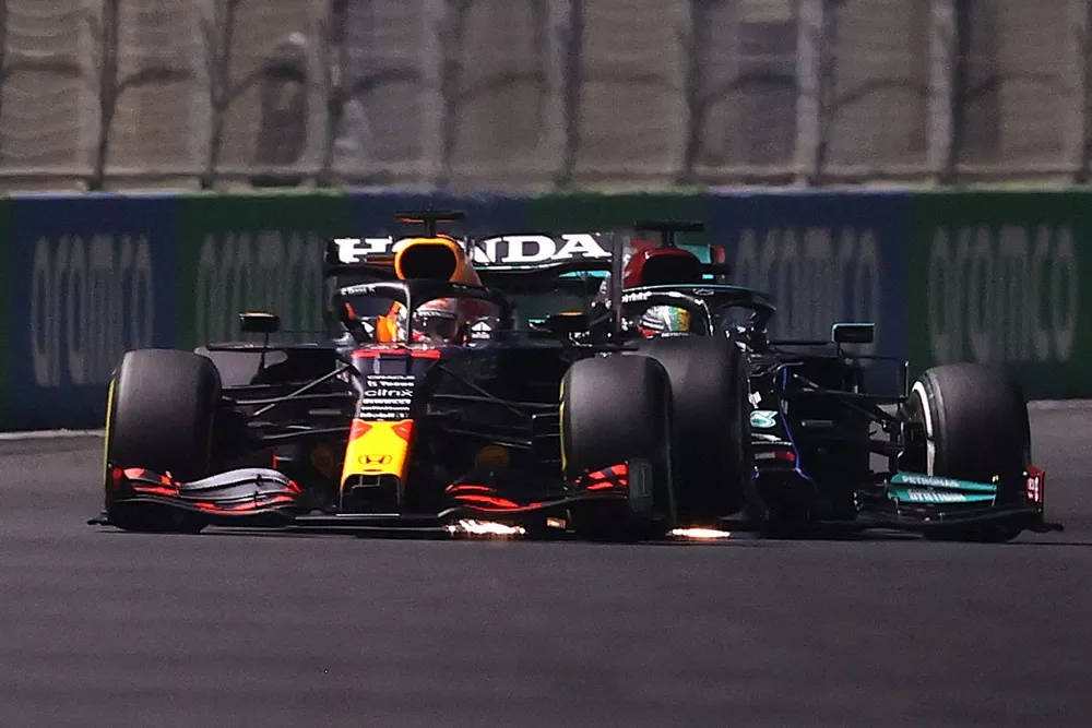 Lewis Hamilton, Mercedes, hits Max Verstappen, Red Bull Racing