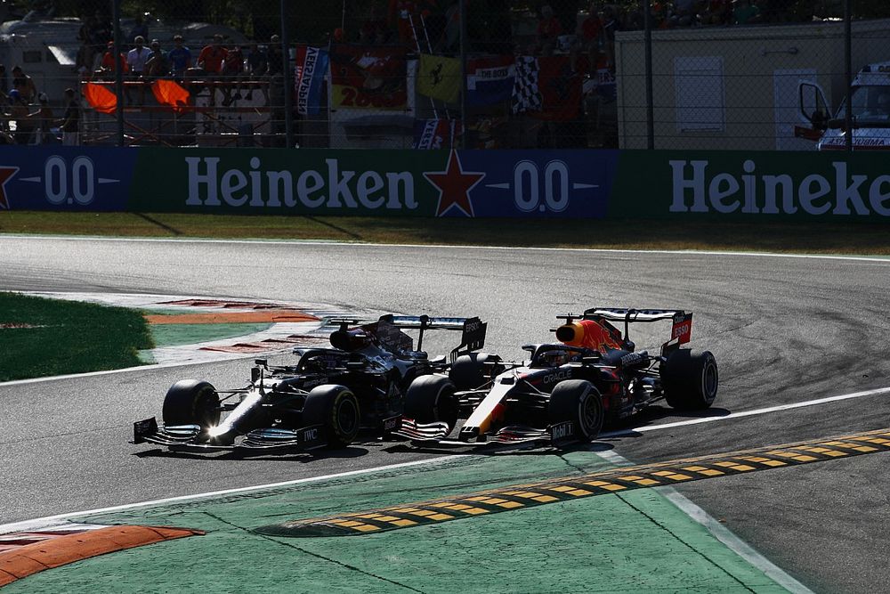 Lewis Hamilton, Mercedes W12, and Max Verstappen, Red Bull Racing RB16B, crash out of the race