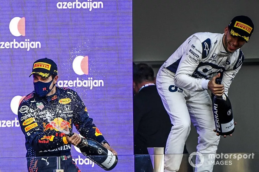 Sergio Perez, Red Bull Racing, 1st position, celebrates on the podium