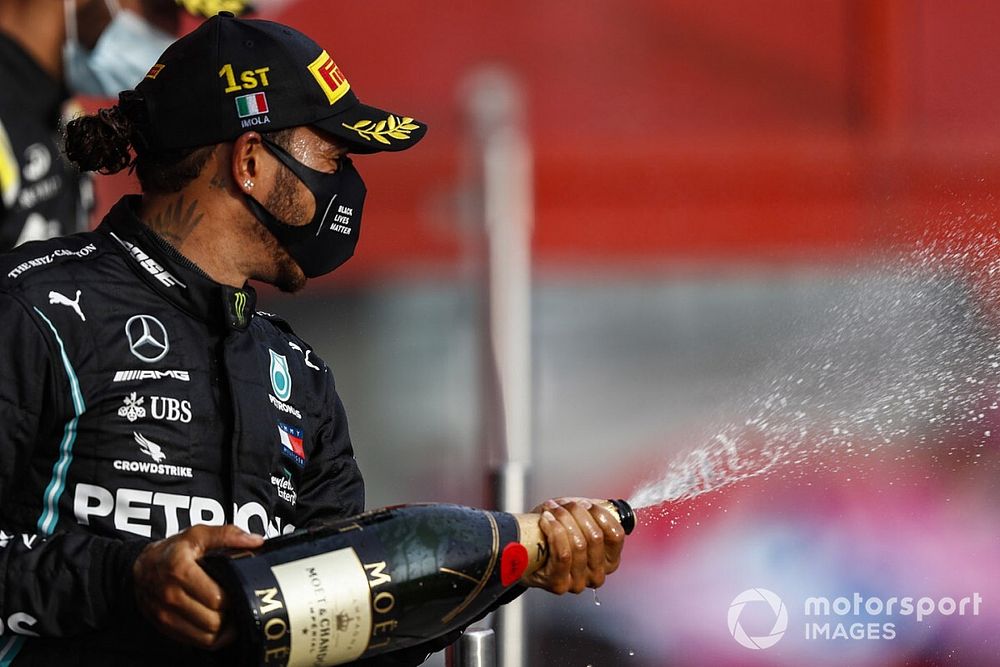 Lewis Hamilton, Mercedes-AMG F1, 1st position, sprays Champagne from the podium