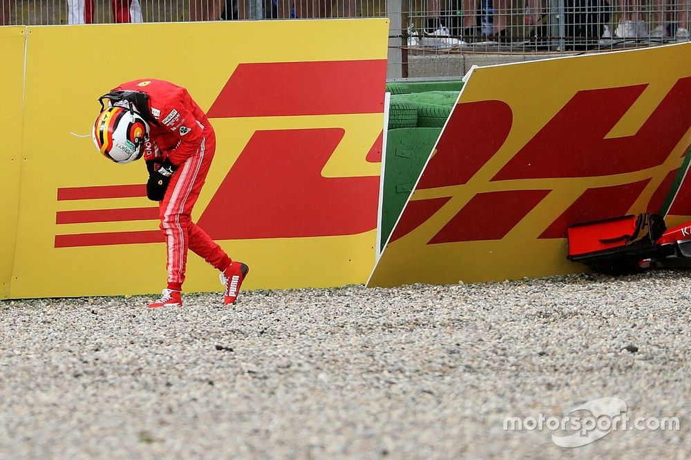 Sebastian Vettel, Ferrari SF71H walks in after crashing out of the race