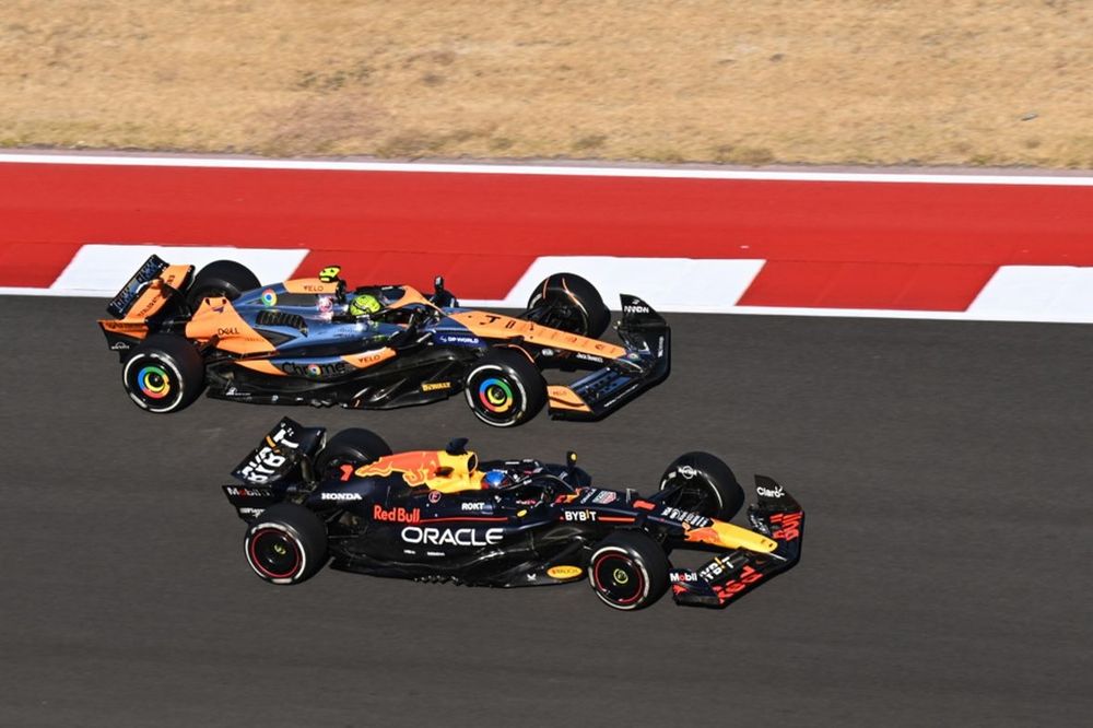 Lando Norris, McLaren MCL38, battles with Max Verstappen, Red Bull Racing RB20