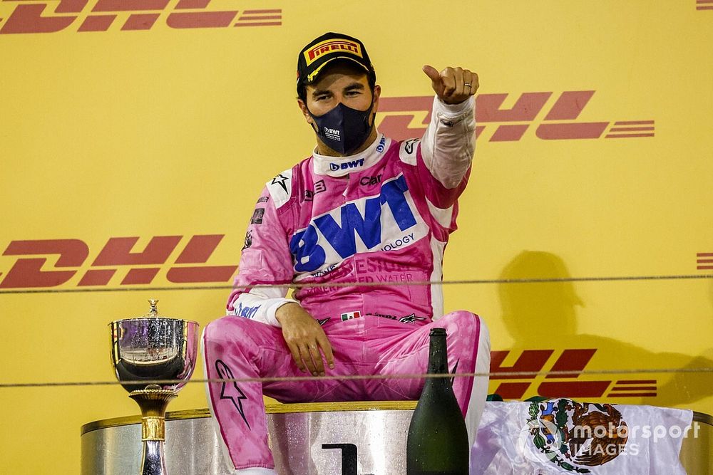 Sergio Perez, Racing Point, 1st position, takes a seat on the podium