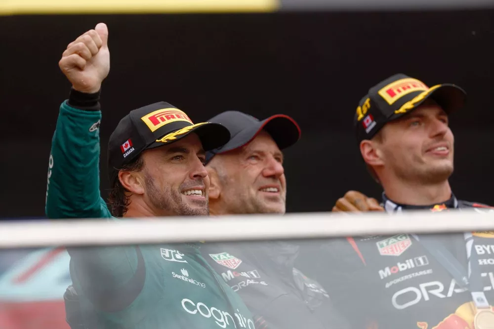 Fernando Alonso, Aston Martin F1 Team, 2nd position, Adrian Newey, Chief Technology Officer, Red Bull Racing, Max Verstappen, Red Bull Racing, 1st position, on the podium