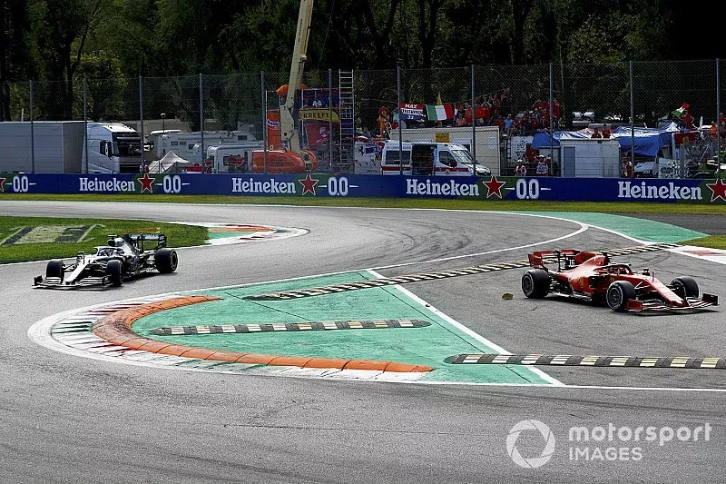 Charles Leclerc, Ferrari SF90 cuts the corner whilst Lewis Hamilton, Mercedes AMG F1 W10 chases 