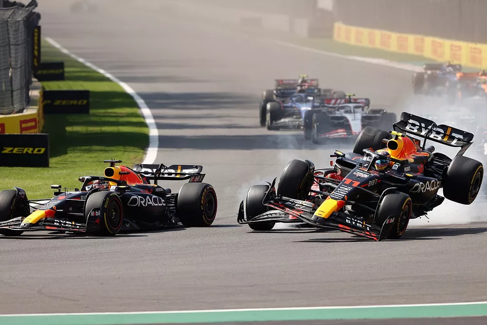 Max Verstappen, Red Bull Racing RB19, as Charles Leclerc, Ferrari SF-23, Sergio Perez, Red Bull Racing RB19, make contact at the start causing the Mexican to crash out