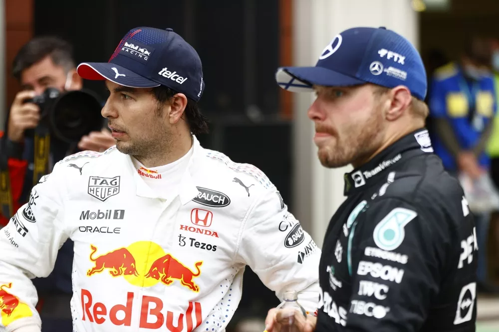 Sergio Perez, Red Bull Racing, 3rd position, and Valtteri Bottas, Mercedes, 1st position