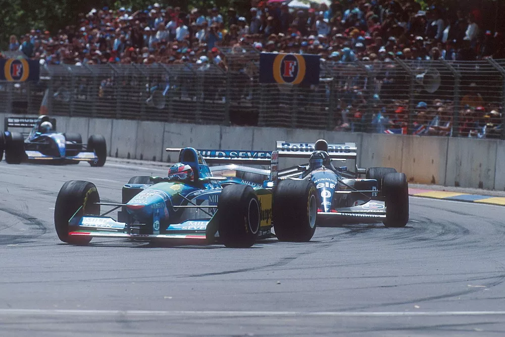 Michael Schumacher, Benetton B194 leads with Damon Hill, Williams FW16B