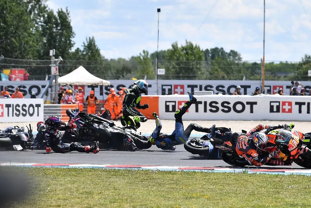 TOPSHOT - Riders collide after the start during the Hungarian Motorcycle MotoGP Grand Prix at the Balaton Park circuit in Balatonfokajar, Hungary, on June 7, 2026. (Photo by Ferenc ISZA / AFP via Getty Images)