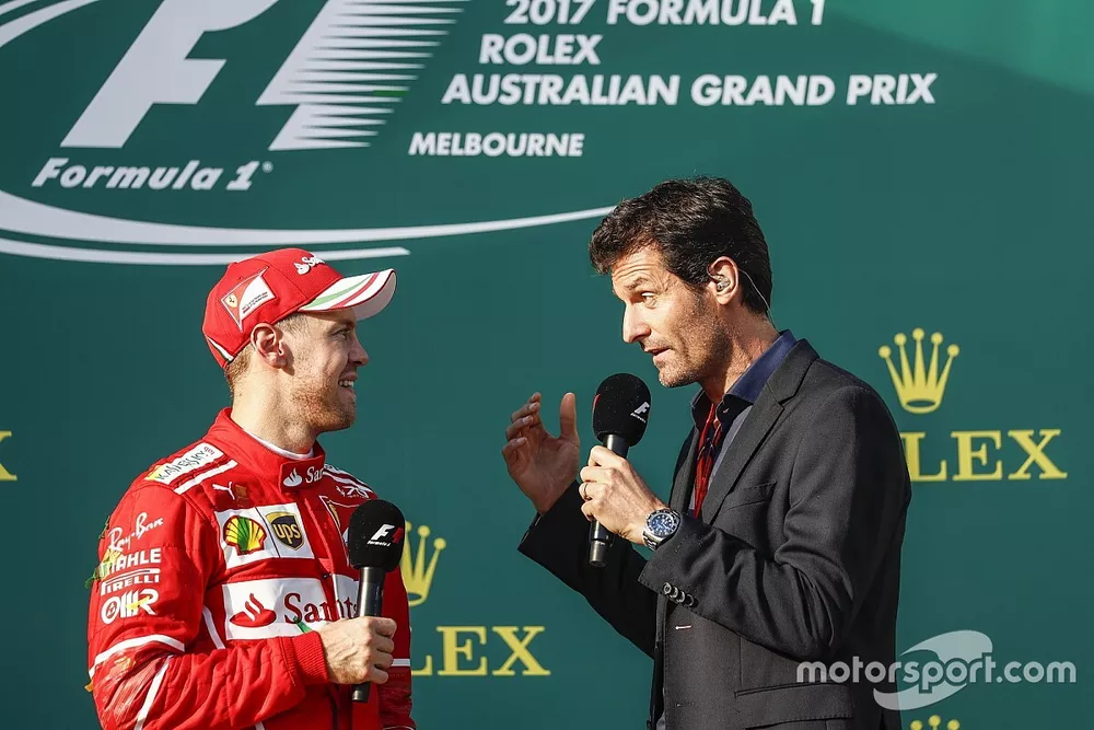 Sebastian Vettel, Ferrari, 1st Position, is interviewed by Mark Webber on the podium