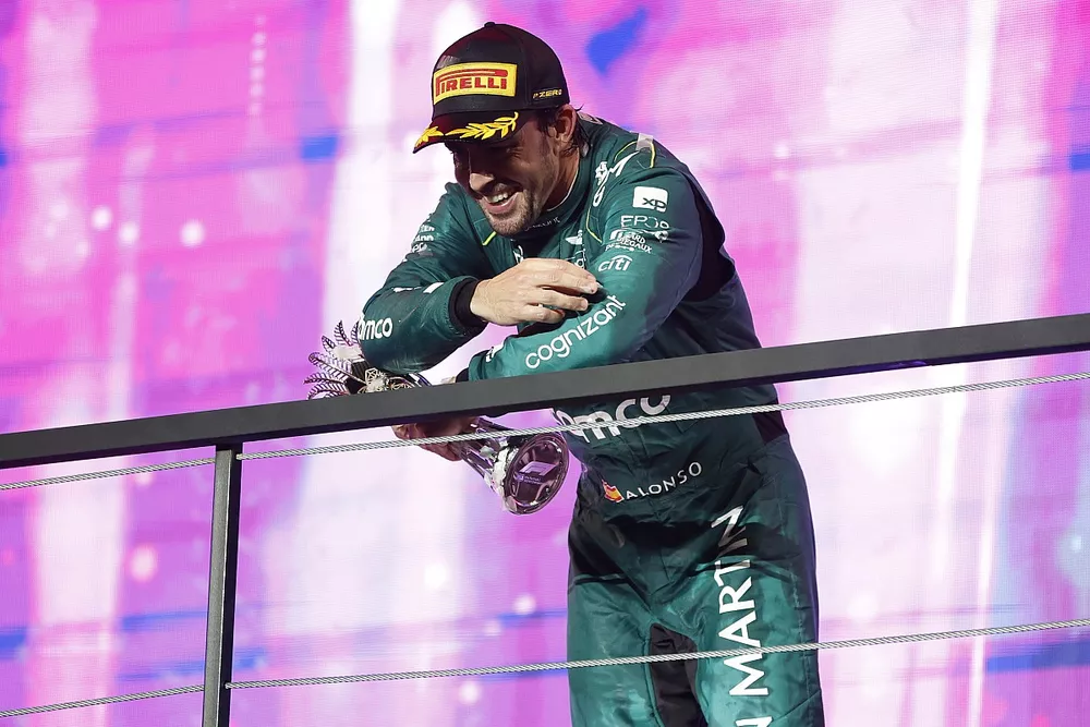 Fernando Alonso, Aston Martin F1 Team, 3rd position, on the podium with his trophy