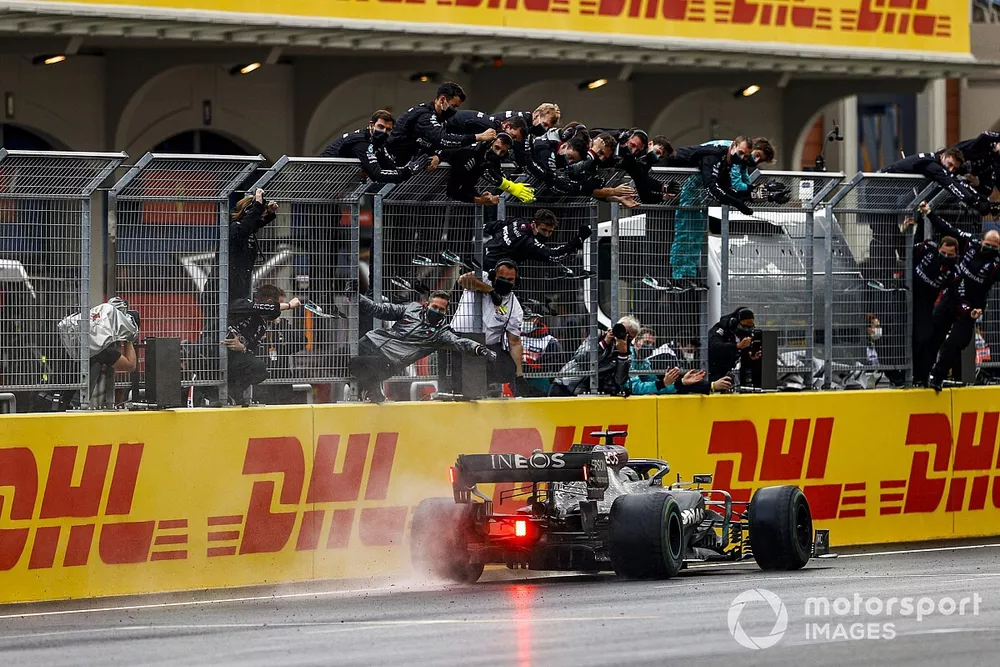 Lewis Hamilton, Mercedes F1 W11, 1st position, takes victory to secure his seventh drivers title as the Mercedes team cheer from the pit wall