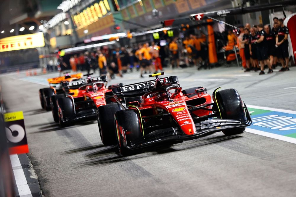 Carlos Sainz, Ferrari SF-23, Charles Leclerc, Ferrari SF-23, in the pit lane
