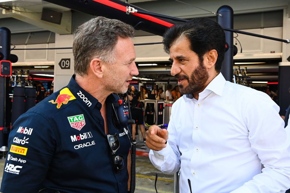 Christian Horner, Team Principal, Red Bull Racing, Mohammed bin Sulayem, President, FIA, talk in the pit lane