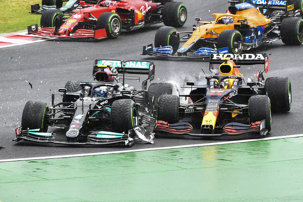 Valtteri Bottas, Mercedes W12, collides with Sergio Perez, Red Bull Racing RB16B, at the start