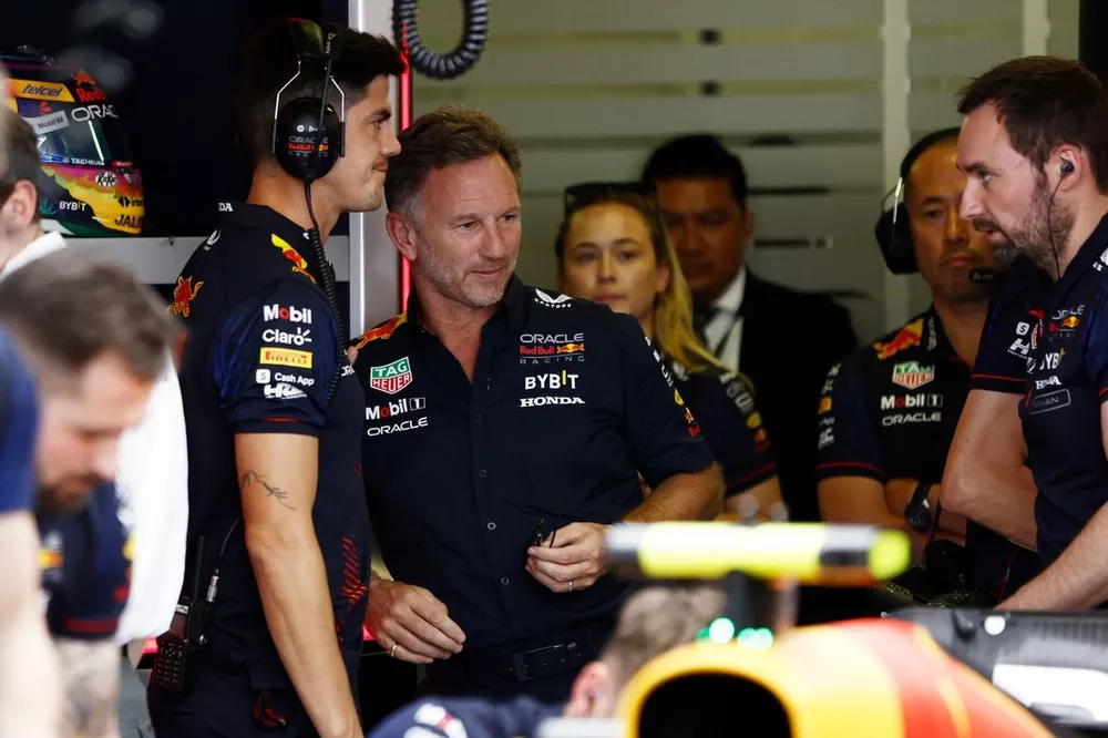 Jo Canales and Christian Horner, Team Principal, Red Bull Racing, in the garage 