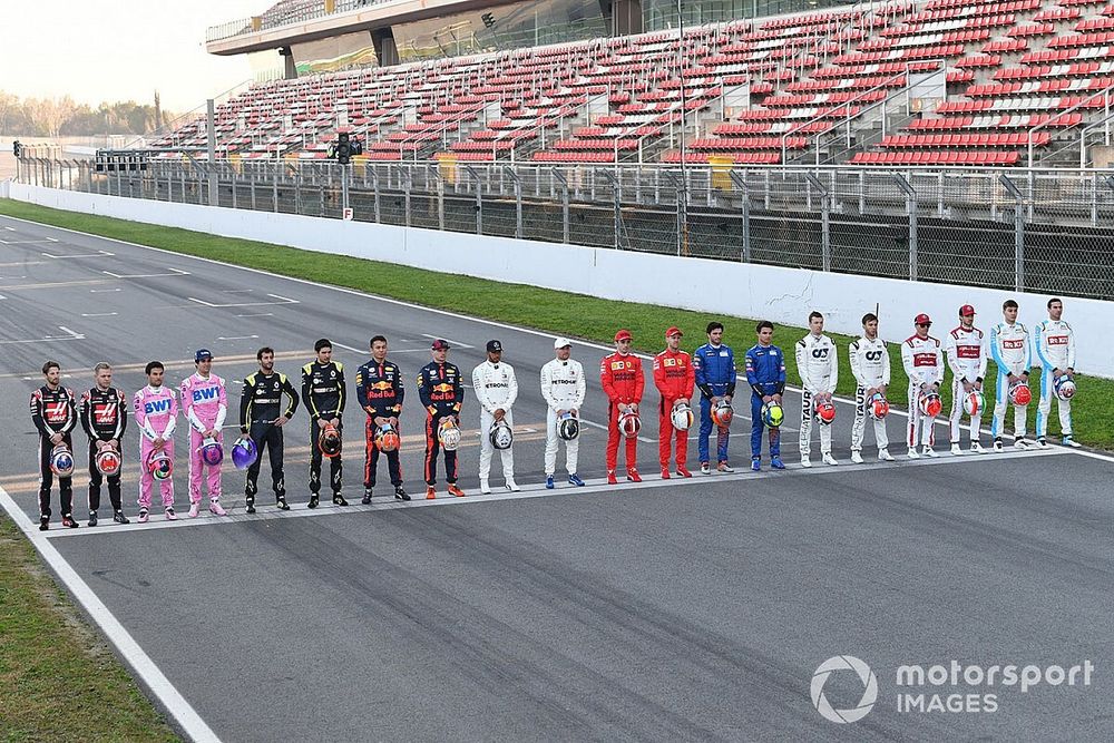 The drivers line up across the track