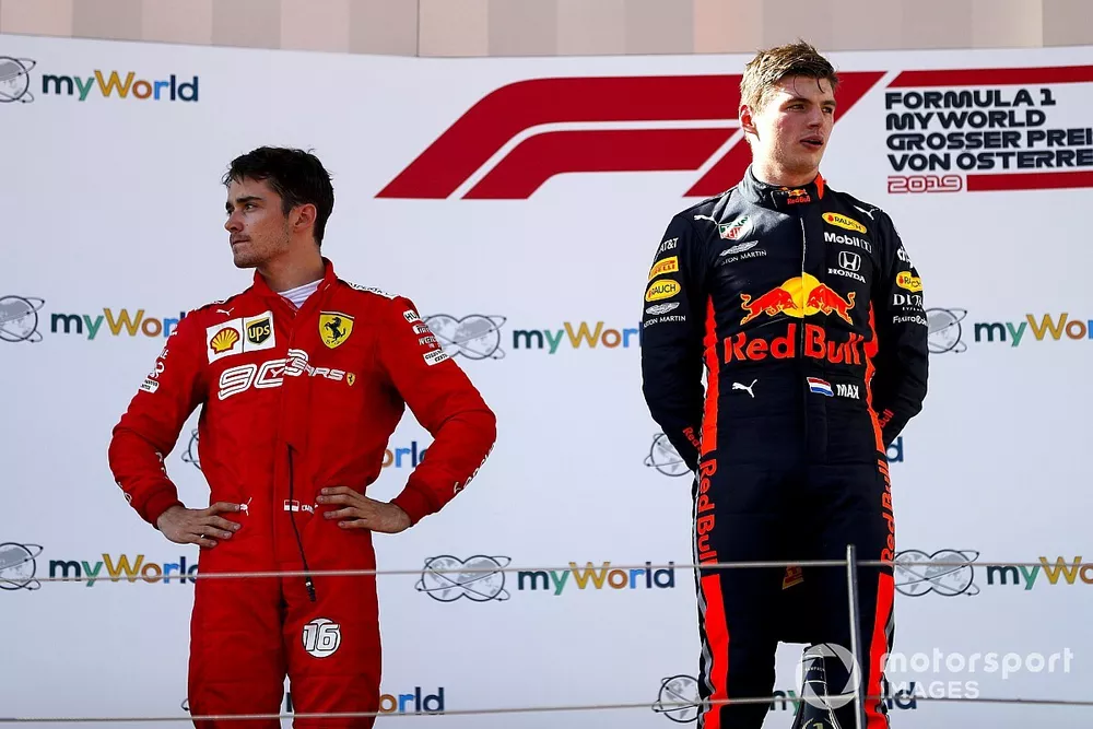 Charles Leclerc, Ferrari and Race winner Max Verstappen, Red Bull Racing on the podium 