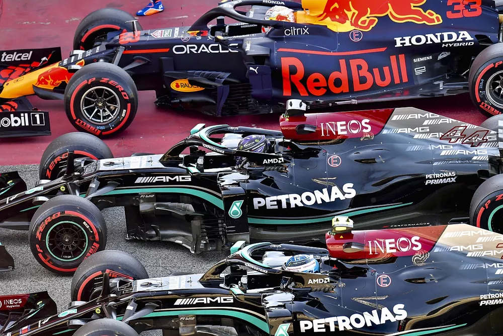 Pole man Lewis Hamilton, Mercedes W12, Max Verstappen, Red Bull Racing RB16B, and Valtteri Bottas, Mercedes W12, arrive in Parc Ferme after Qualifying